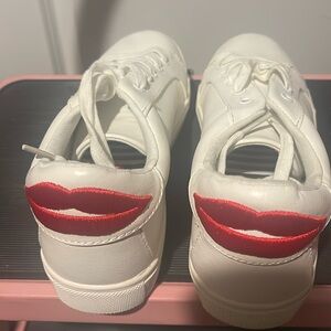 Size 9 Betsy Johnson sneakers with cute lips on the back